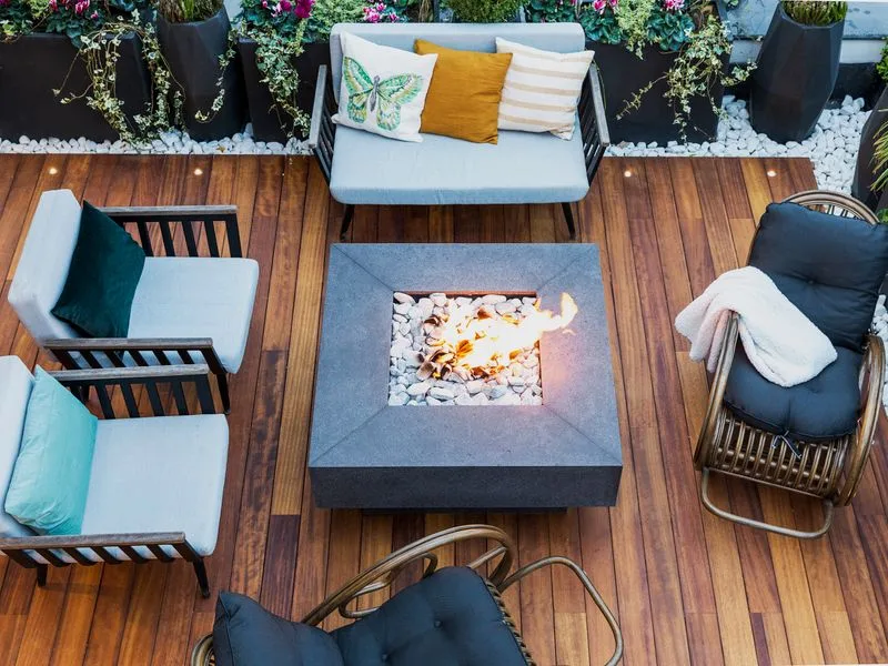 Backyard deck with built-in seating and a fire feature